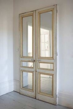 Repurpose old doors with mirrors