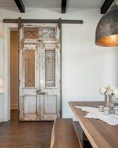 Rejuvenate an old door with sliding rails
