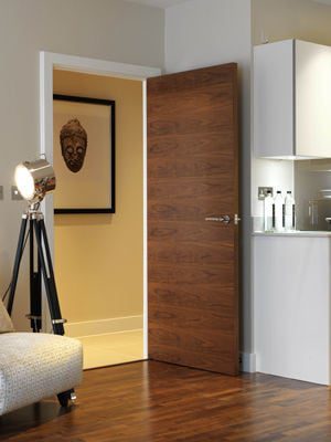 Walnut internal door in a modern setting