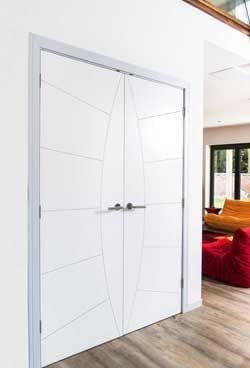 Contemporary white internal door pair in a modern home