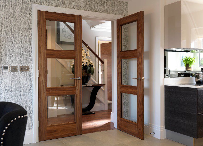 Glass wooden interior doors into an open plan living area